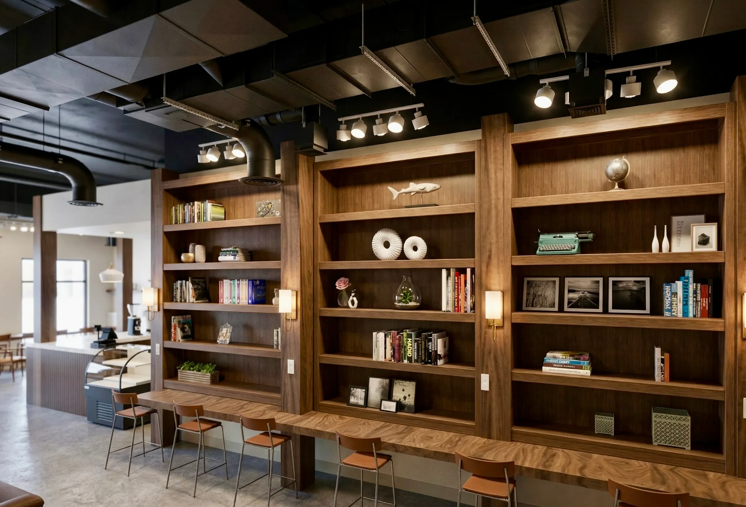 A floor-to-ceiling walnut bookcase wall lined with books and curiosities.